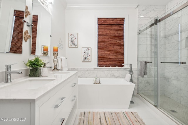 full bath with ornamental molding, a soaking tub, a sink, and a shower stall