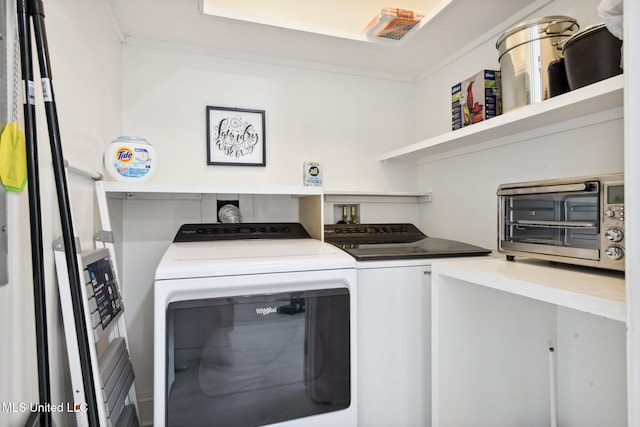 laundry room with laundry area, a toaster, and independent washer and dryer