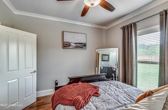 bedroom with crown molding, a ceiling fan, baseboards, and dark wood-style floors