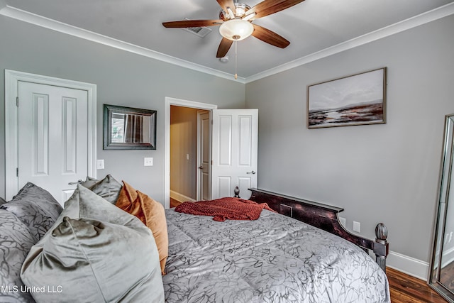 bedroom with crown molding, baseboards, ceiling fan, and wood finished floors