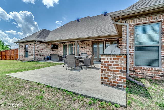 view of patio / terrace featuring an outdoor kitchen and fence