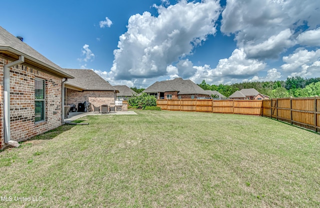 view of yard with a fenced backyard and a patio