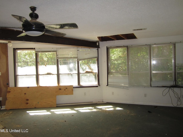 1934 Blue Ridge Rd, Fulton, MS 38843 - spare room featuring plenty of natural light, a ceiling fan, and a textured ceiling