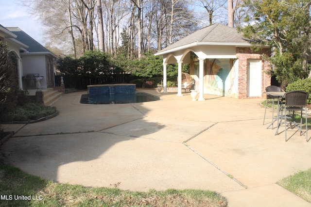 view of patio with an outbuilding