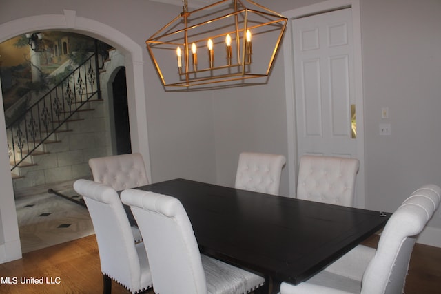 dining room featuring a notable chandelier and wood-type flooring