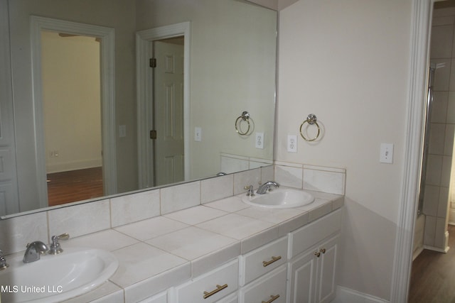 bathroom featuring vanity and hardwood / wood-style flooring