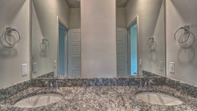 bathroom with double vanity and a sink