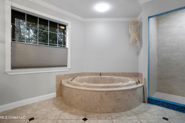 bathroom featuring a tub to relax in, tile patterned floors, and crown molding