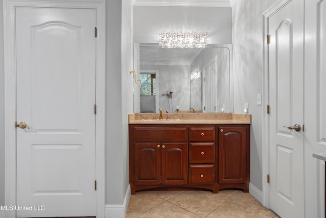 bathroom with tile patterned flooring, vanity, and crown molding