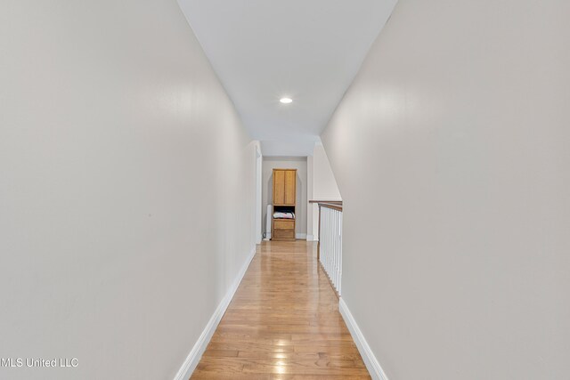 corridor with light wood-type flooring