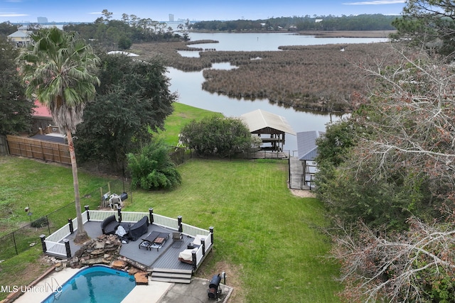 birds eye view of property with a water view