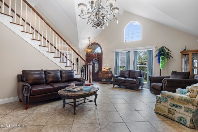 tiled living room featuring high vaulted ceiling and an inviting chandelier