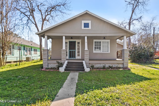 bungalow-style house featuring a porch and a front yard