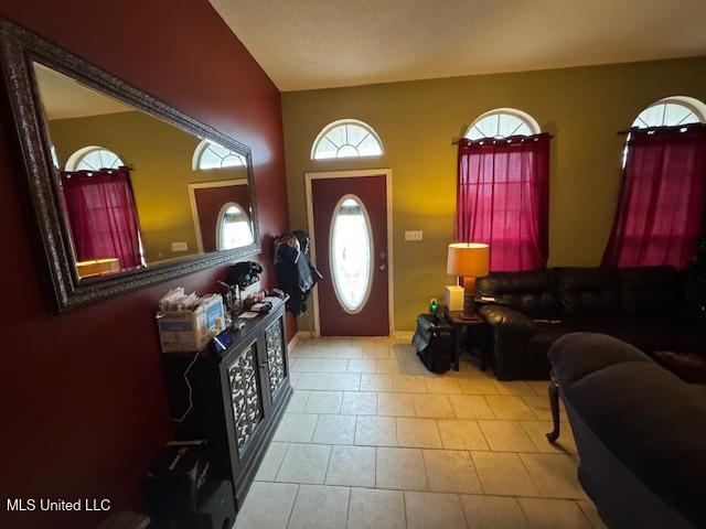 foyer entrance featuring light tile patterned floors