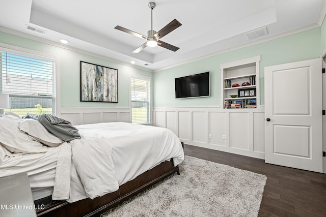 4432 John Wood Ln, Olive Branch, MS 38654 - bedroom with a raised ceiling, dark wood finished floors, crown molding, recessed lighting, and wainscoting