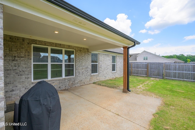 4432 John Wood Ln, Olive Branch, MS 38654 - fenced backyard featuring a patio area and grilling area