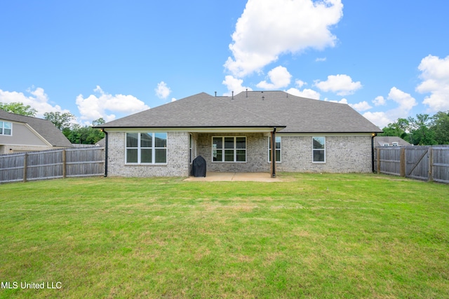 4432 John Wood Ln, Olive Branch, MS 38654 - rear view of house featuring a patio area, a fenced backyard, brick siding, and roof with shingles