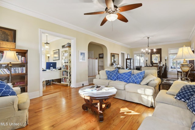 600 N Beach Blvd, Bay Saint Louis, MS 39520 - living room with arched walkways, a ceiling fan, wood finished floors, crown molding, and a chandelier