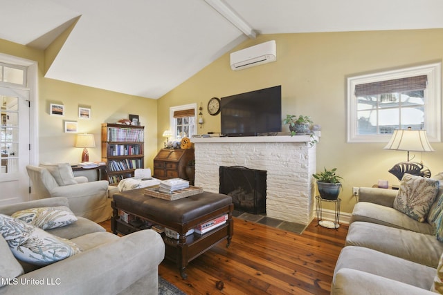 600 N Beach Blvd, Bay Saint Louis, MS 39520 - living area featuring a wall mounted air conditioner, dark wood finished floors, healthy amount of natural light, and a fireplace
