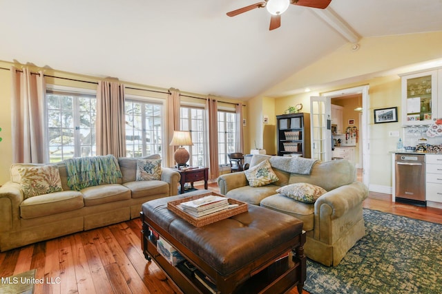 600 N Beach Blvd, Bay Saint Louis, MS 39520 - living area with light wood-style floors, ceiling fan, and a bar