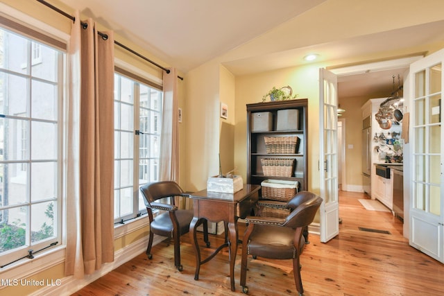 600 N Beach Blvd, Bay Saint Louis, MS 39520 - sitting room with vaulted ceiling, light wood-style floors, a desk, and french doors