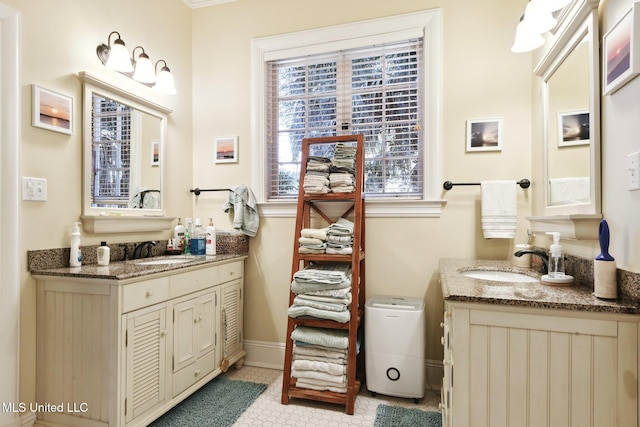 600 N Beach Blvd, Bay Saint Louis, MS 39520 - bathroom featuring two vanities and tile patterned flooring