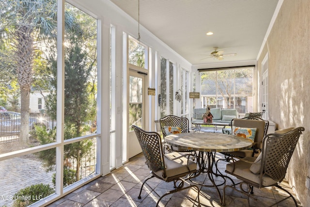 600 N Beach Blvd, Bay Saint Louis, MS 39520 - sunroom / solarium with ceiling fan and outdoor dining area