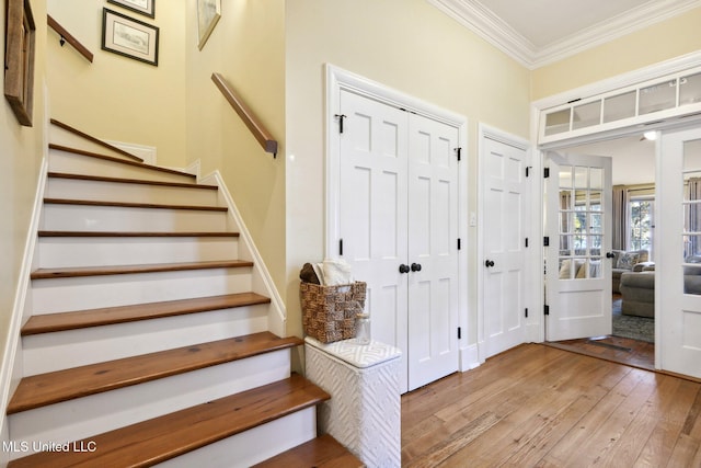 600 N Beach Blvd, Bay Saint Louis, MS 39520 - entrance foyer with hardwood / wood-style floors, stairs, and crown molding