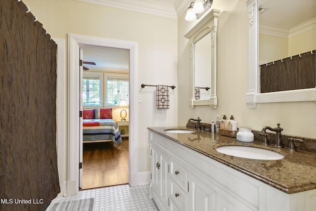 600 N Beach Blvd, Bay Saint Louis, MS 39520 - ensuite bathroom with crown molding and double vanity