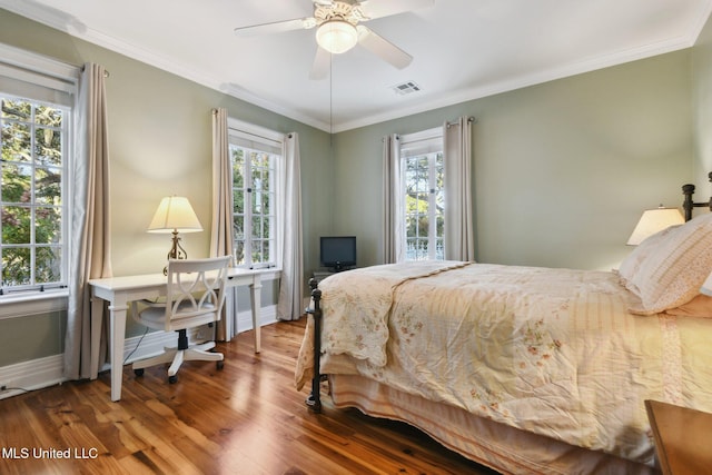 600 N Beach Blvd, Bay Saint Louis, MS 39520 - bedroom with wood finished floors, crown molding, an office area, and a ceiling fan