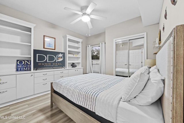 bedroom featuring light wood-style floors, a ceiling fan, and a closet