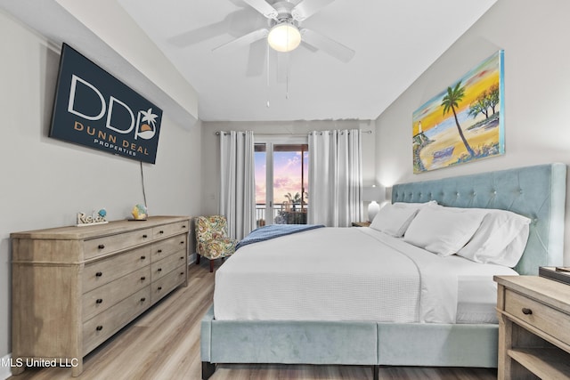 bedroom with light wood-style floors and a ceiling fan