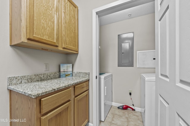 laundry area featuring laundry area, electric panel, independent washer and dryer, light tile patterned floors, and baseboards