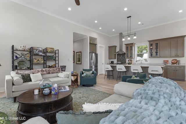 435 Bills Ave, Ocean Springs, MS 39564 - living room featuring light wood-style floors, recessed lighting, ornamental molding, and a ceiling fan