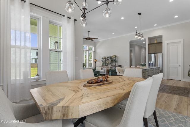 435 Bills Ave, Ocean Springs, MS 39564 - dining space featuring crown molding, light wood-type flooring, recessed lighting, and a ceiling fan