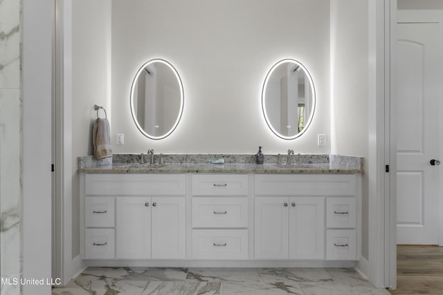 435 Bills Ave, Ocean Springs, MS 39564 - full bathroom with marble finish flooring, double vanity, and baseboards