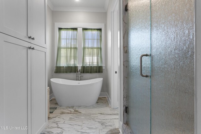 435 Bills Ave, Ocean Springs, MS 39564 - bathroom featuring a shower stall, marble finish flooring, a freestanding bath, baseboards, and ornamental molding
