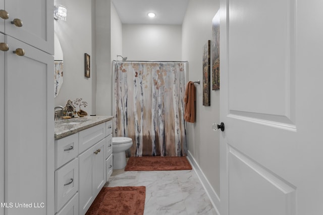 435 Bills Ave, Ocean Springs, MS 39564 - full bathroom featuring marble look tile flooring, toilet, vanity, baseboards, and curtained shower