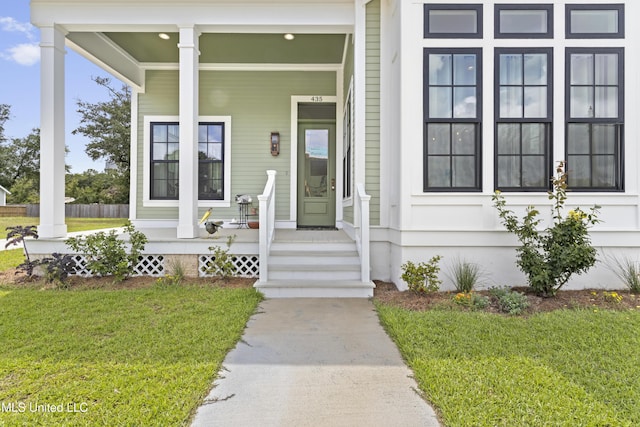 435 Bills Ave, Ocean Springs, MS 39564 - view of exterior entry featuring covered porch and a yard