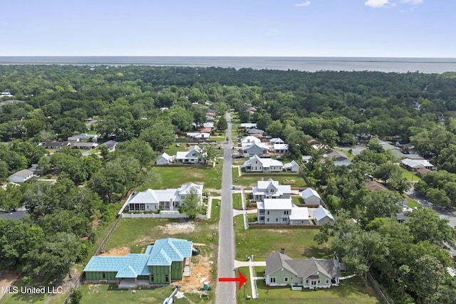 435 Bills Ave, Ocean Springs, MS 39564 - aerial perspective of suburban area featuring a nearby body of water and a forest