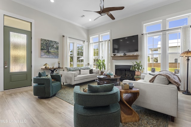 435 Bills Ave, Ocean Springs, MS 39564 - living area featuring ornamental molding, ceiling fan, a fireplace, light wood-type flooring, and recessed lighting