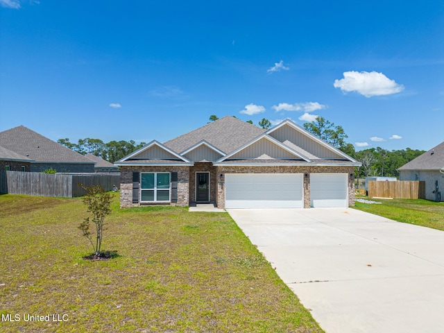 11458 Leann Ct, Ocean Springs, MS 39564 - view of front facade with brick siding, a garage, driveway, and board and batten siding