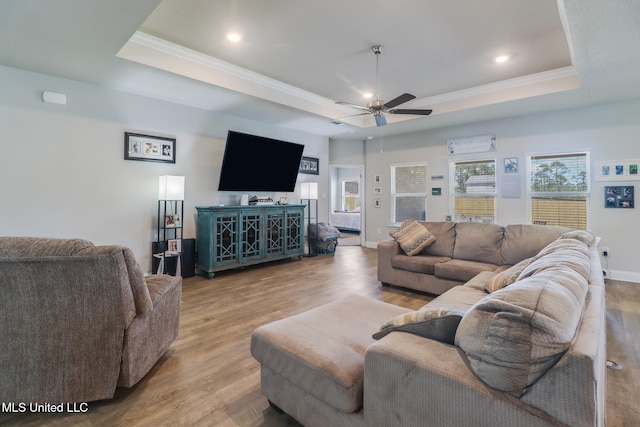 11458 Leann Ct, Ocean Springs, MS 39564 - living room featuring a raised ceiling, crown molding, a ceiling fan, wood finished floors, and recessed lighting