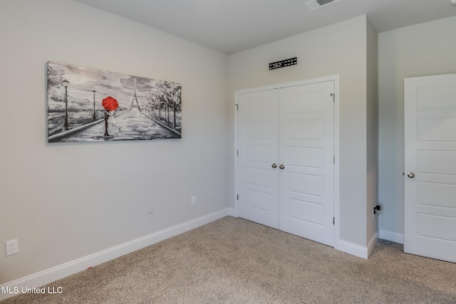 11458 Leann Ct, Ocean Springs, MS 39564 - unfurnished bedroom featuring carpet, baseboards, and a closet