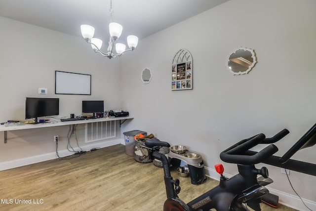 11458 Leann Ct, Ocean Springs, MS 39564 - office area with baseboards, wood finished floors, and a chandelier
