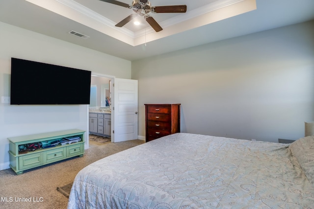 11458 Leann Ct, Ocean Springs, MS 39564 - bedroom featuring crown molding, light carpet, a tray ceiling, ensuite bathroom, and ceiling fan