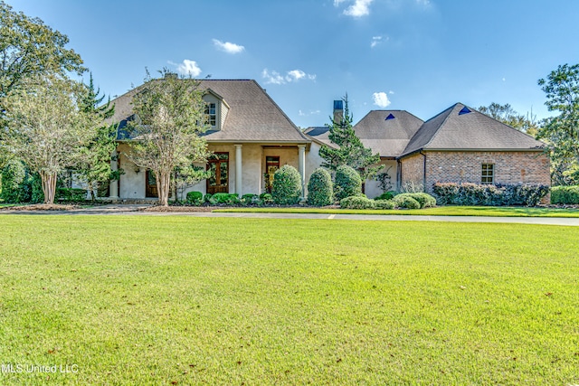 view of front of property with a front lawn