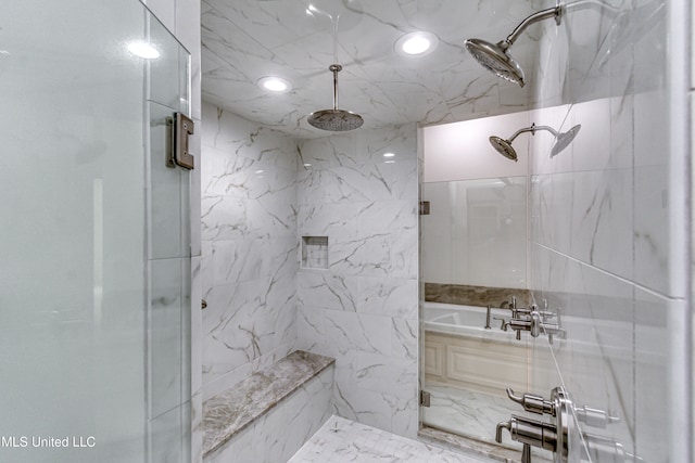 bathroom featuring shower with separate bathtub