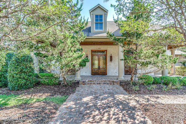 doorway to property with a porch