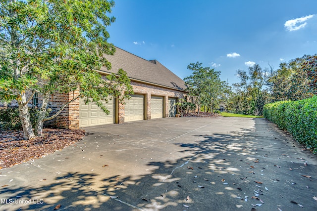 view of side of property with a garage